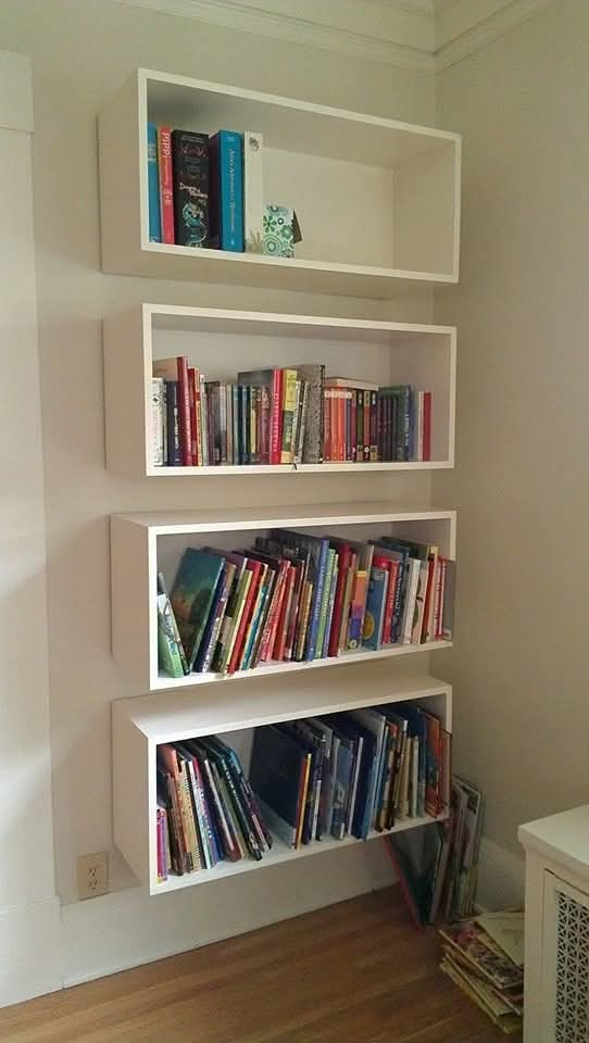 A library with elegant shelves to organize books and antiques.